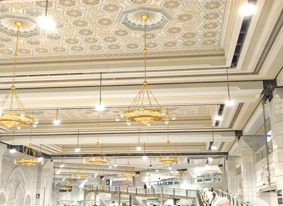 This is inside view of Masjid-Al-Haram. The Grand Mosque in Mecca, Saudi Arabia. The Interior of the mosque is looking like a palace. There are many decorative lights. Other decoratives items with golden colour. The mosque looks so amazing.
