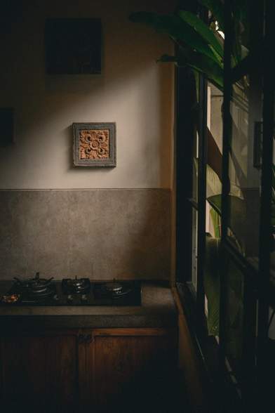 Illumination entering the kitchen space via the window.