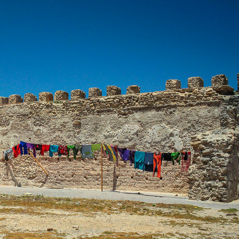 Colorful clothes drying in the wind on a washing line in Morocco