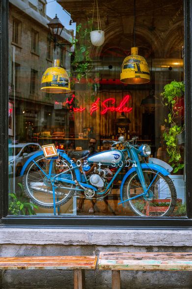 The vibrant street and architecture of Old Montreal reflected and framed in the Slice + Soda shop window with an antique NSU (VW) motorcycle and up-cycled lamp shades decor.
With special guest appearance by bro
Captured by Komeil Karimi