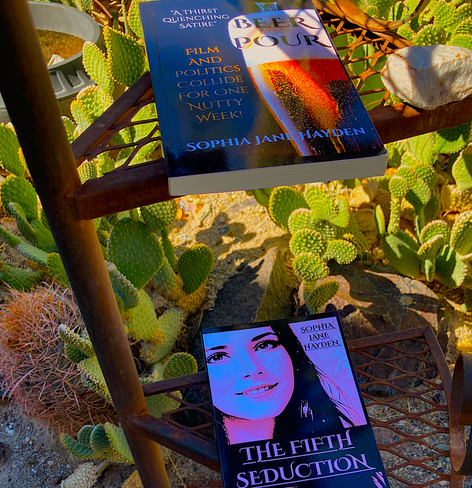 My desert bookshelf. The Fifth Seduction, a sophisticated tale exploring friendships that turn into love, and BEER POUR, my satirical general fiction book about the kookiest contest ever to sell an international diplomatic achievement.