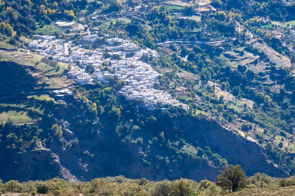 The morning sun has reached all parts of the village but the Barranco de Poqueira remains in shadow,