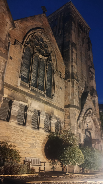 The facade and tower of King's Church, illuminated at night