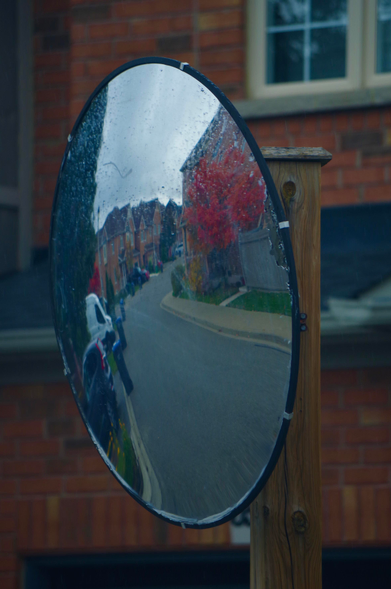 Safety mirror in a residential street.