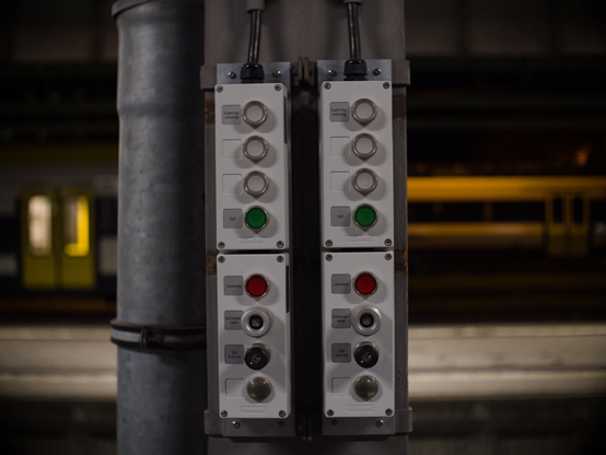 buttons in a railwaysation in colour