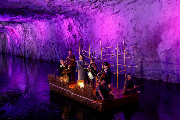 Taiwanese opera singer Wei Hai-min performs on a raft inside Zhaishan Tunnel.