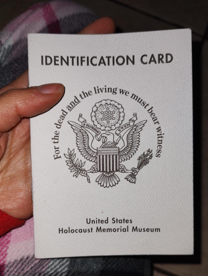 Paper ID (centered at the top it says identification card ).
From the holocaust memorial museum in Washington DC (it's written centered and at the bottom).
In the center there's an emblem of the U.S.A. eagle and on top of it you can read: for the dead and the living we must bear witness.