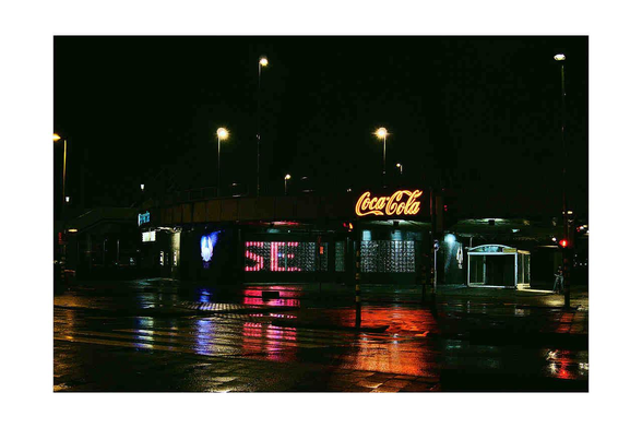 Photo of a rainy Rotterdam with colorfull reflections 