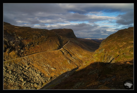 Crazy road along the autumn valley