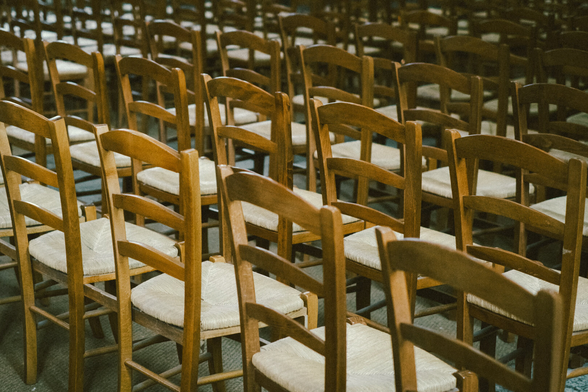 Rows of wooden chairs in a church
