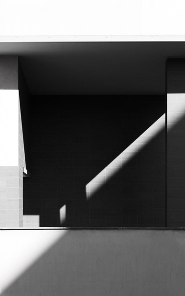 Black and white abstract photo with light and shadow patterns.