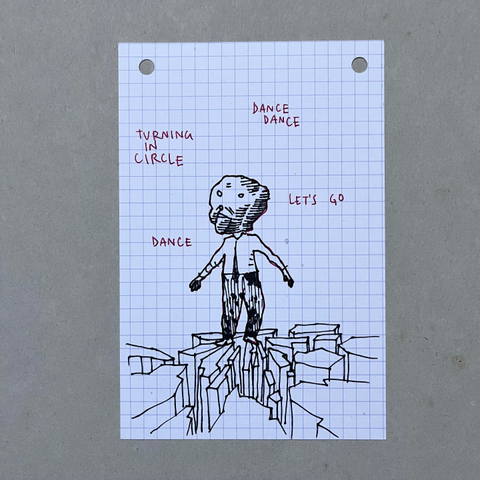 A series of four drawings on  index card. Each one is showing a man on the top of a cliff. He’s wearing an oversized mask that looks like a ventriloquist’s puppet, dressed with a white shirt and a black tie. He’s alone, surrounded by what seems to be instructions to dance : Shake your shoulders, lift your arms up, move your feet, tap your feet clench your teeth, turning in circles, let’s go