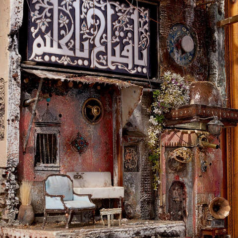 a miniature home marred by war