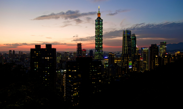 Nightfall over Taipei with the Taipei 101 tower in the center.