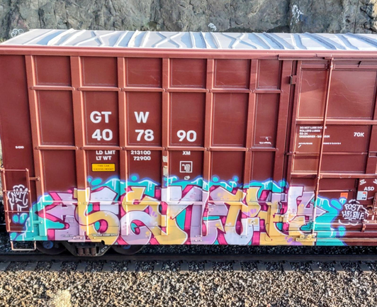 Train car with graffiti rolling through Kamloops BC Canada