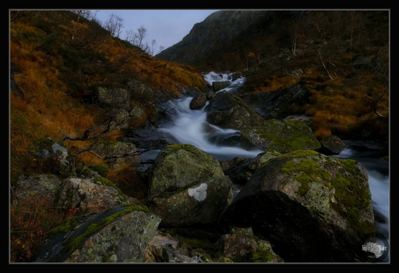 Stream between the rocks in autumn mood.