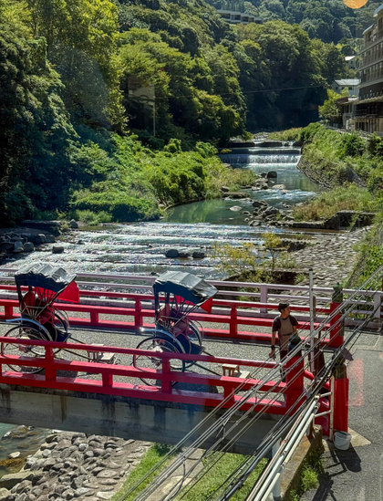 Rickshaw riders waiting for customers on bridge in Hakone, Japan