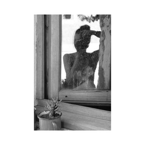 Self-portrait of the photographer in a window pane, with a small cactus placed on the sill. (Version françæ) Autoportrait dal photographe dans læ vitre d’æn fenêtre, avec æn mignæn cactus posæ sur læ rebord.