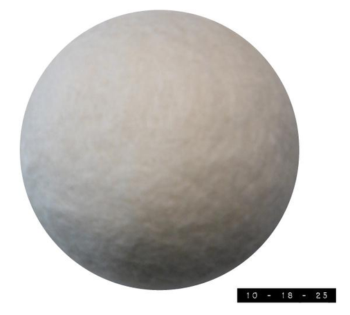 Wool dryer ball.  About 3 inches in diameter.  I'm told that adding two to four of these to my clothes when I put them in my dryer softens my clothes, reduces static cling, gets rid of wrinkles, and  speeds up drying time.  All I know for sure is that when I run my dryer with them alone they make the sort of banging noises a  toddler with a drum set might make on an off night.  Which is why I now run my dryer much more often  than I run my radio or TV.   