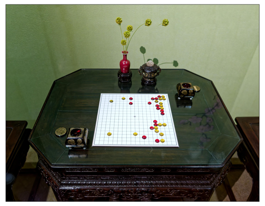 Table with Go board, stones, bowls, and a vase with flowers (items from Zhou 1046 BCE through Qing CE 1911).