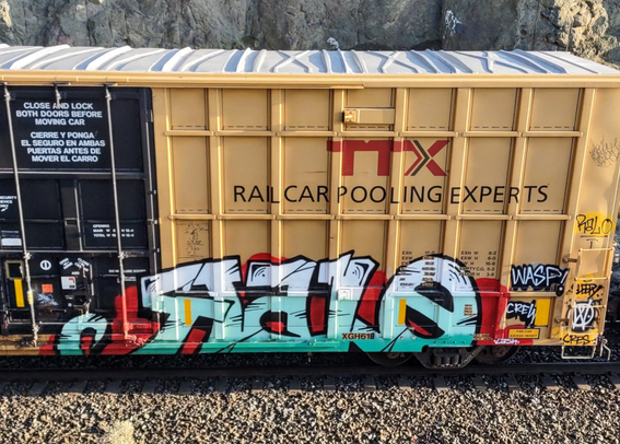 Train car with graffiti rolling through Kamloops BC Canada