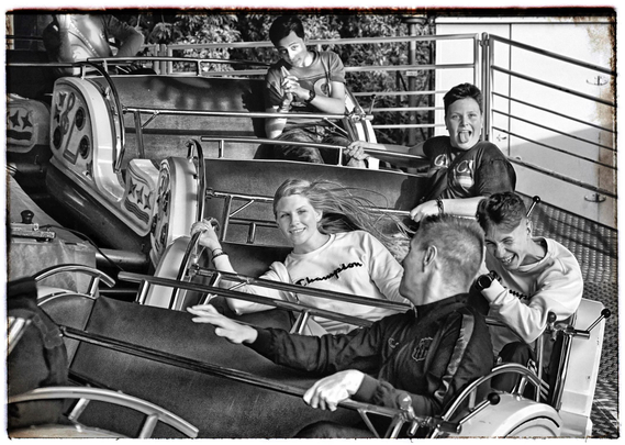 Young people excited on a twister at. Funfair