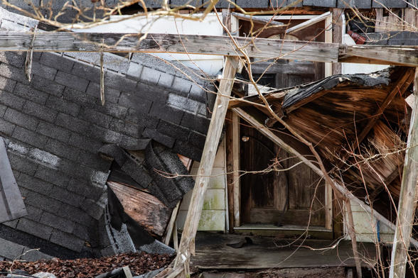 A collapsed porch roof.