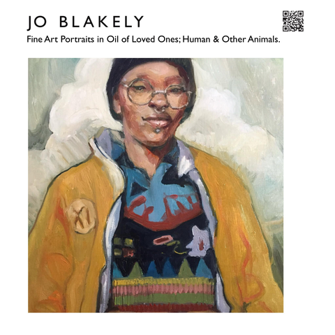 Portrait of a Black young non binary person in a very cool colorful sweater, with yellow jacket over it, with piercings and round reading glasses, and a knit toque. 

Shown on my promo card. 