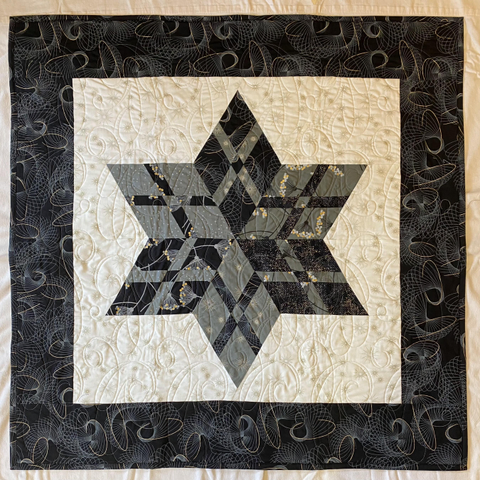 Quilt with gray star