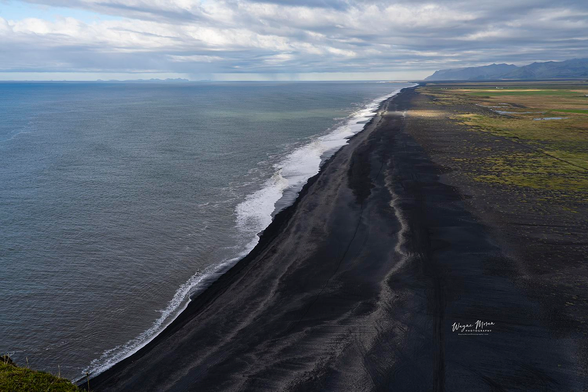 Endless Black Sand Coast from Dyrhólaey, Iceland

From the heights of Dyrhólaey, the southern coast of Iceland stretches out in a sweeping, almost endless line where deep black volcanic sand meets the rolling waves of the Atlantic Ocean. This breathtaking panorama captures the raw beauty and scale of a land carved by fire and sculpted by the sea. The shoreline arcs gracefully toward distant mountains, where green moss and rugged lava plains blend into the horizon beneath dramatic northern skies.

Gentle surf washes ashore in rhythmic white strokes, creating a striking contrast against the dark sand. The scene feels both powerful and peaceful, filled with movement yet wrapped in stillness. Looking out from this cliffside viewpoint, one senses the immensity of nature and the humbling wonder of standing in a world still shaped by the elements.

This is one of Iceland’s most iconic coastal vistas, a place where ocean, earth, and sky unite in a bold, unforgettable expression of natural beauty and God’s incredible artistry.

Image:
https://fineartamerica.com/featured/endless-black-sand-coast-from-dyrholaey-iceland-wayne-moran.html

Read more:
https://waynemoranphotography.com/blog/chasing-light-across-iceland-our-21-day-adventure/

#Dyrhólaey #Iceland #blacksand #beach #travelPHotogrpahy #Landscape #art #fineart 

#ayearforart #buyintoart