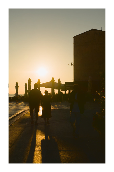 Two lovers with sunset nearing in the background