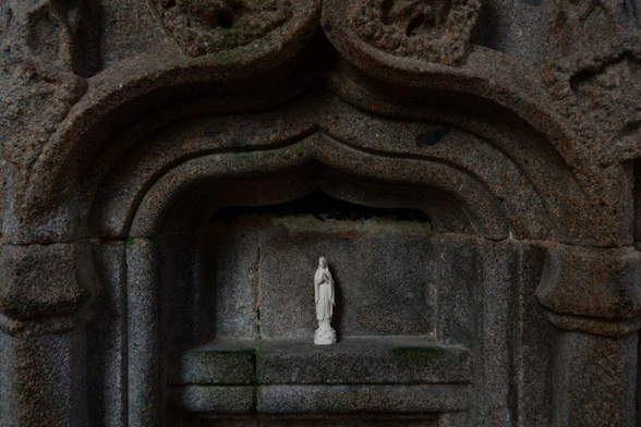 a figure of Mary in a niche
