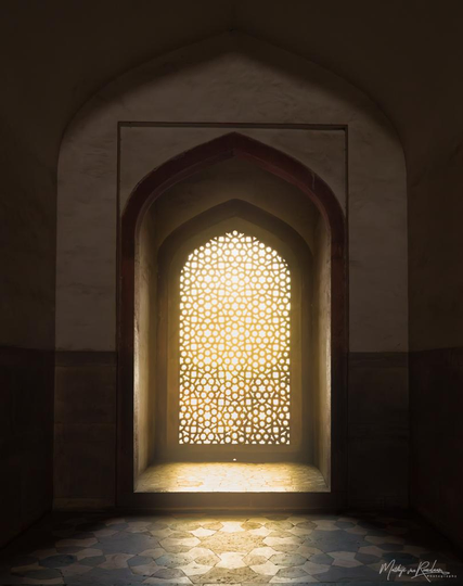Window in Humanyuns Tomb where the sunlight strikes through the integratedly detailed stone window