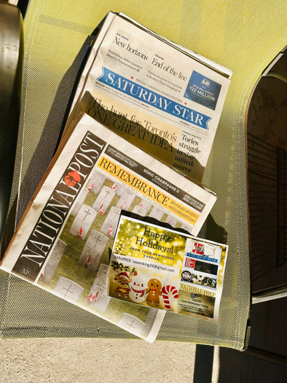 Saturday Star and National Post on a chair.