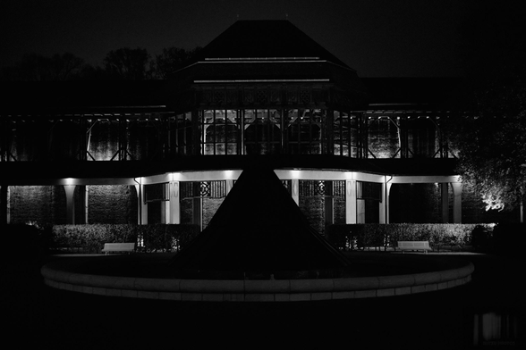 Night-time black-and-white photograph of the historic graduation house in the Royal Bavarian Spa Gardens in Bad Reichenhall in the Berchtesgadener Land region.