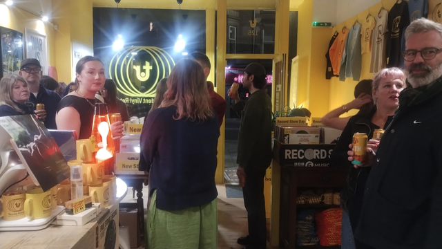 People gathering in Thorne Records for the launch of a vinyl EP by one of the store's staff, Rosie H Sullivan