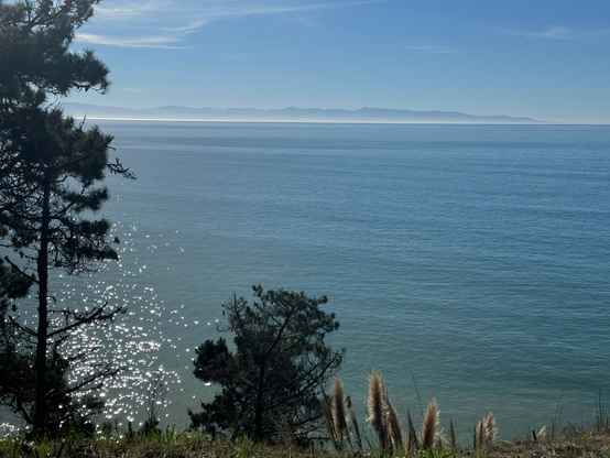 Monterey and Pacific Grove on the peninsula across the Monterey Bay looking south east from New Brighton State Beach.