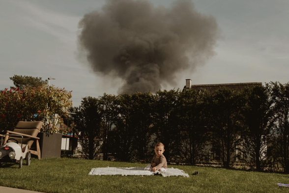 He kept playing while the air thickened. I stayed quiet, watching him framed between bushes and smoke. It wasn’t the fire that moved me, it was his stillness inside it. I took the picture without thinking too much. Only later did I realise how often childhood continues, even when the sky shifts.