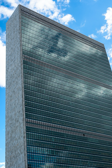 U.N. Headquarters building reflecting clouds