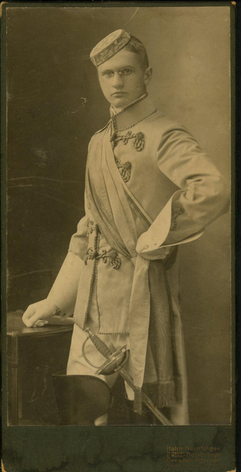 Photograph of Gerhard Hille, Braunschweig, 1913. There is also, on the reverse, the symbol used by Student Fraternities in Germany, which suggests this is a fraternity photograph, and the fraternity he was a member of was a fighting one: thus the fencing foil.