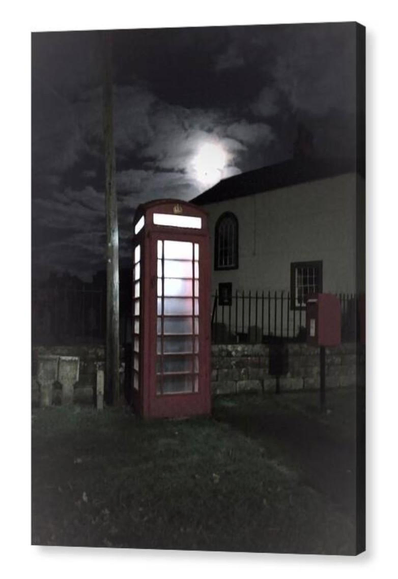 Colour portrait photograph of a British red telephone box under a full moon.  The image is shown printed upon a block canvas.