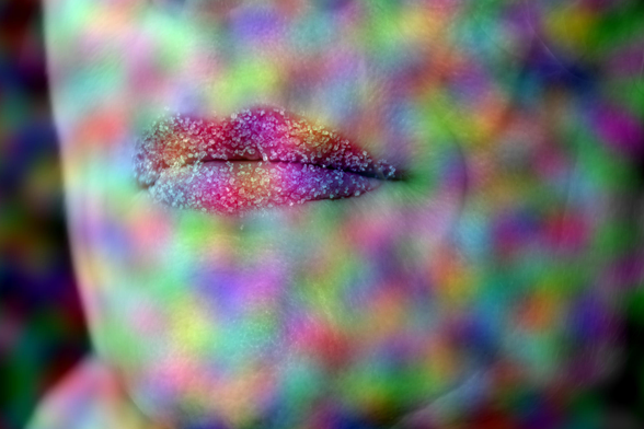 Lips with sugar covered in bright, multicolored lights and patterns. The background and surrounding area also feature the same vibrant, swirling colors, creating a visually abstract and dynamic effect. 
### 
Lippen mit Zucker bedeckt mit hellen, mehrfarbigen Lichtern und Mustern. Der Hintergrund und die Umgebung zeichnen sich auch durch die gleichen lebendigen, wirbelnden Farben aus, die einen visuell abstrakten und dynamischen Effekt erzeugen.