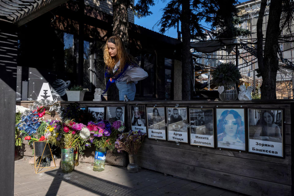 Darka Harnyk, 25, looks at the memorial site for people who died in the popular Ria Pizza restaurant when it was hit by a Russian missile in 2023, in the frontline city of Kramatorsk, Ukraine