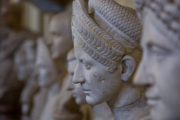 Zoom at the antient marble face sculpture