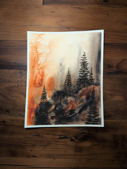 This is an Atmospheric Landscape Painting in portrait orientation on Arches Coldpress watercolor paper using  Daniel Smith Quinacridone Burnt Orange and Hematite Genuine. Orange explodes on the left side almost beyond the landmass which has muted smatterings of orange along with various values of Hematite Genuine. Dark evergreen trees are in the foreground and along the ridge of the bluff. The atmosphere is, again, bursting in orange (with salt for texture) on the left. The center is a luminous pale orange with granulation from Hematite Genuine reaching up at the horizon line and more concentrated on the right side.
