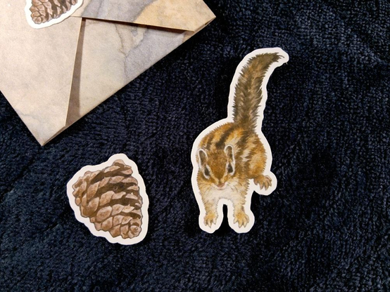 tiny chipmunk sticker and its pinecone