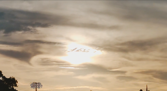 photo of a golden sunset shining through the clouds

WT7