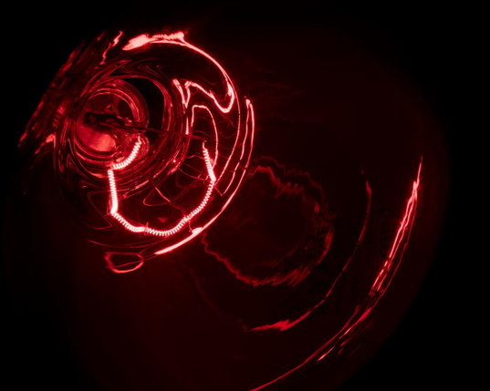 Close-up photo of the glowing hot filament of an incandescent infrared lamp.