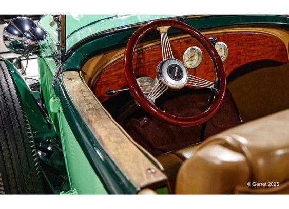 Close-up of a vintage car interior with a polished wooden dashboard, chrome-rimmed gauges, and a red wooden steering wheel. Elegant and classic feel.