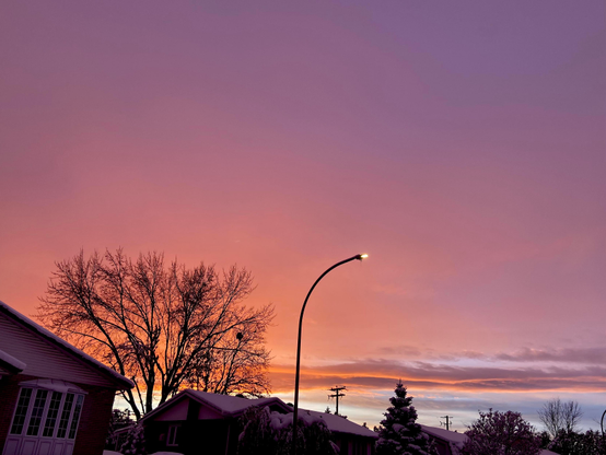 The same scene, but now the clouds have turned bright pink, and we even see a tiny bit of clear blue close to the horizon